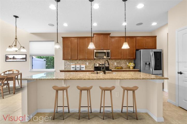 Well designed Cooks Paradise, with granite counters and tile backsplash finishing touches.