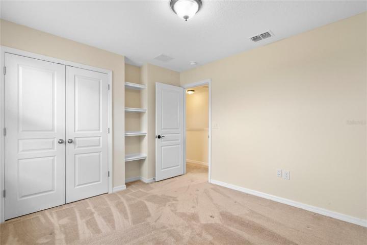 3rd Bedroom with built in shelving.