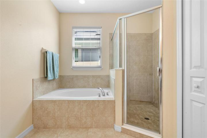 Take an end of day soak in your garden tub and over sized shower.