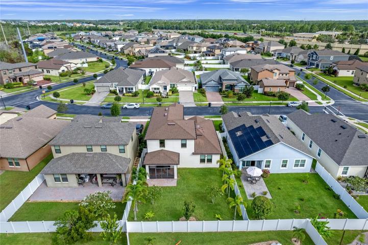 Backyard Aerial View, covered screen porch and paver patio.
