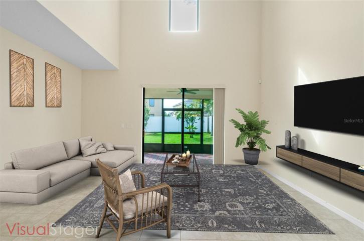 Great room off the Kitchen offers generous space and natural light from the 22 ft soaring ceiling!