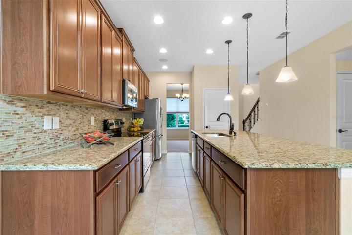 Kitchen offers generous counter prep space and cabinet storage plus good sized Pantry.