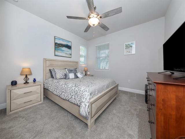 The additional bedroom is located on the back of the home  near the second full bath and creates a tropical oasis for guests