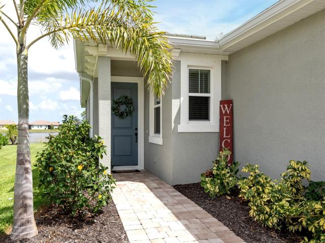 Very welcoming with paver driveway, walkway, beautiful landscape!
