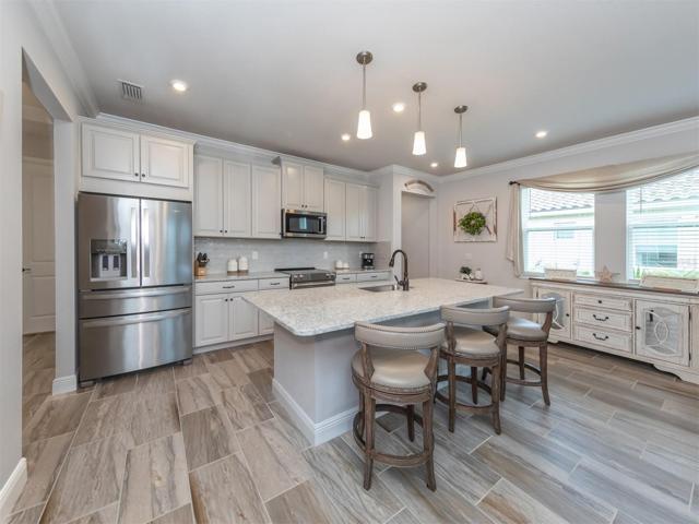 Solid wood cabinetry, soft close drawers, high end stainless appliances, pull out shelving, and quartz countertops make this a chefs dream!