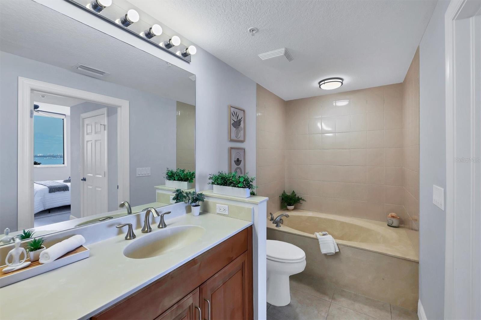 Walk-in glass shower and soaking tub.