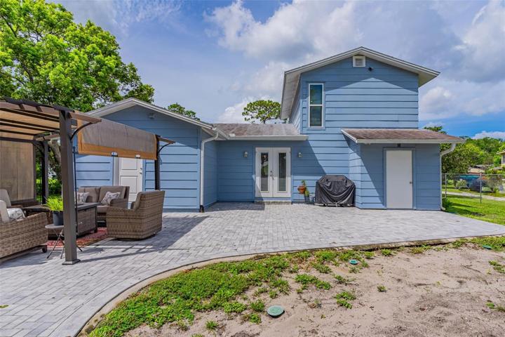 Spacious paver patio out back