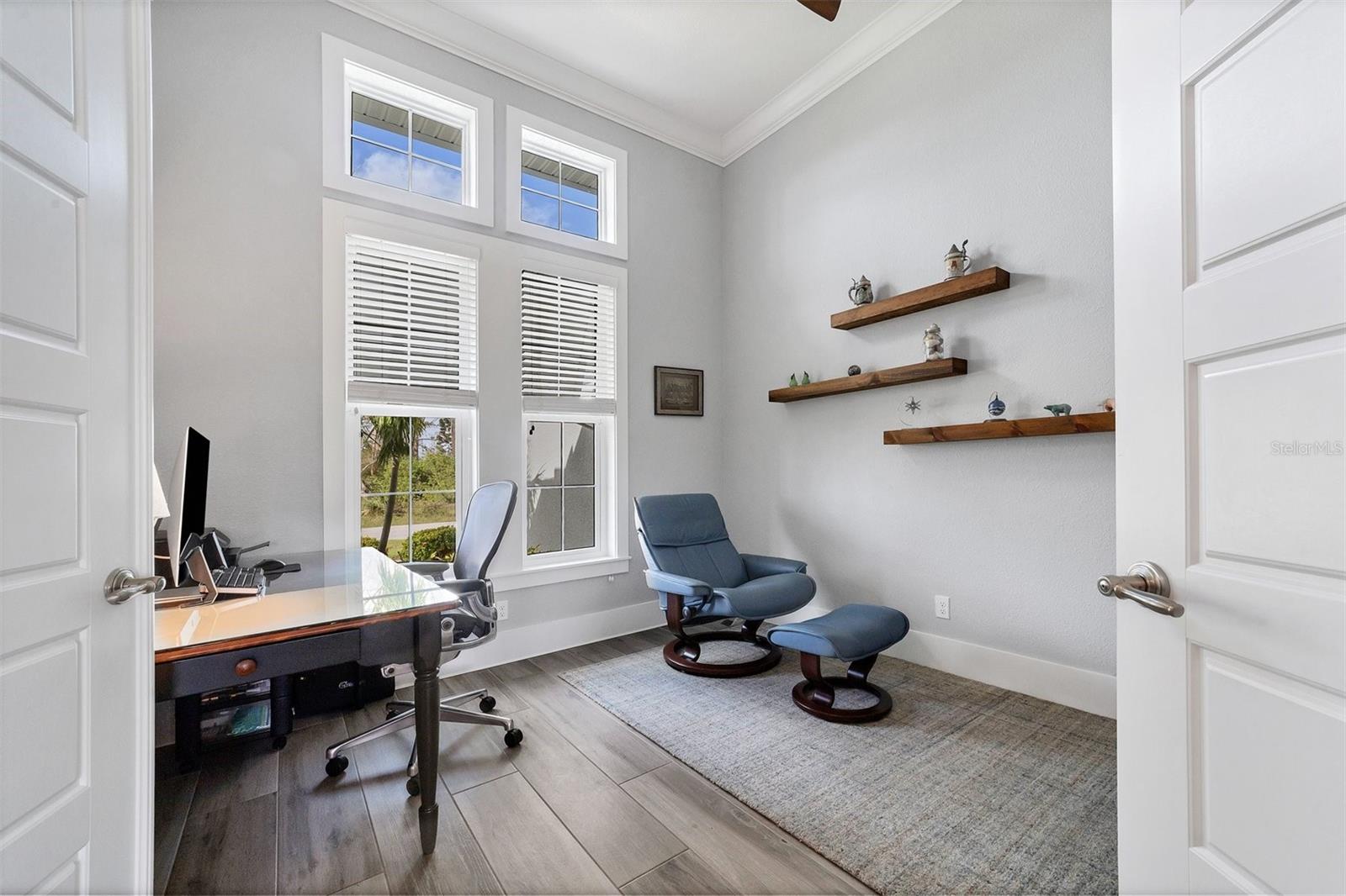 Private Den tucked behind double doors overlooking gardens.