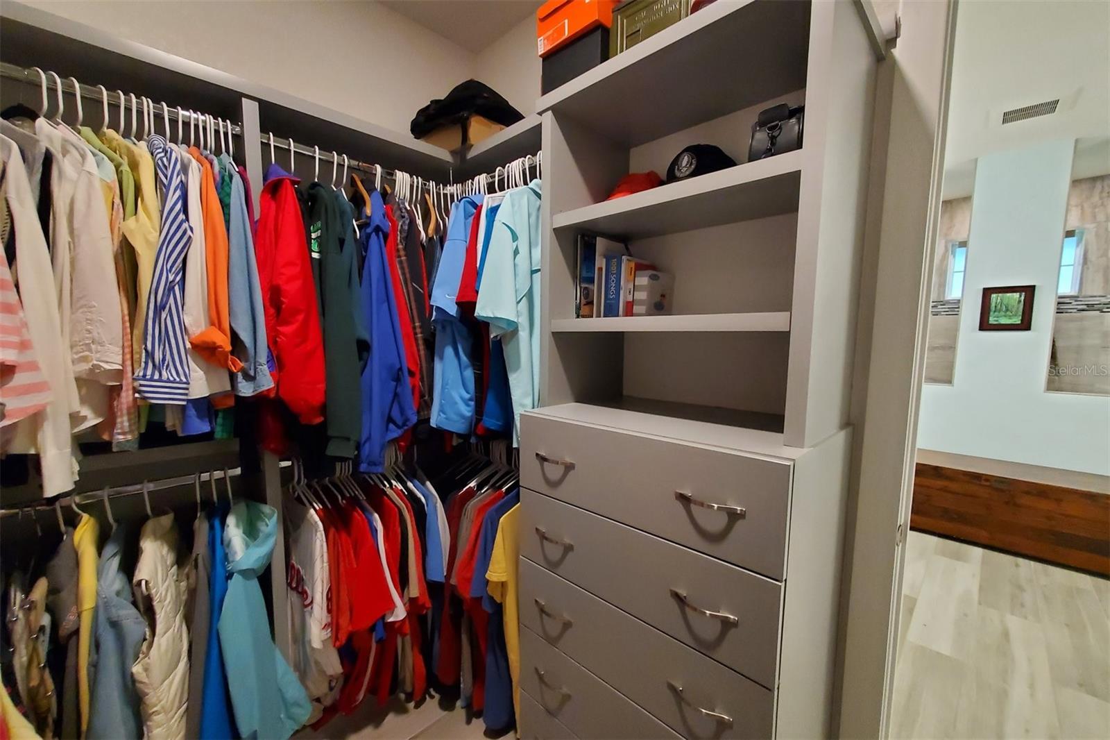 Large laundry room with extended counter and cabinetry.