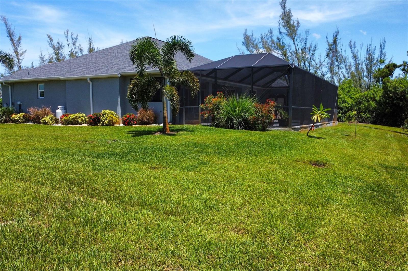 Tropical landscaping provides additional privacy.