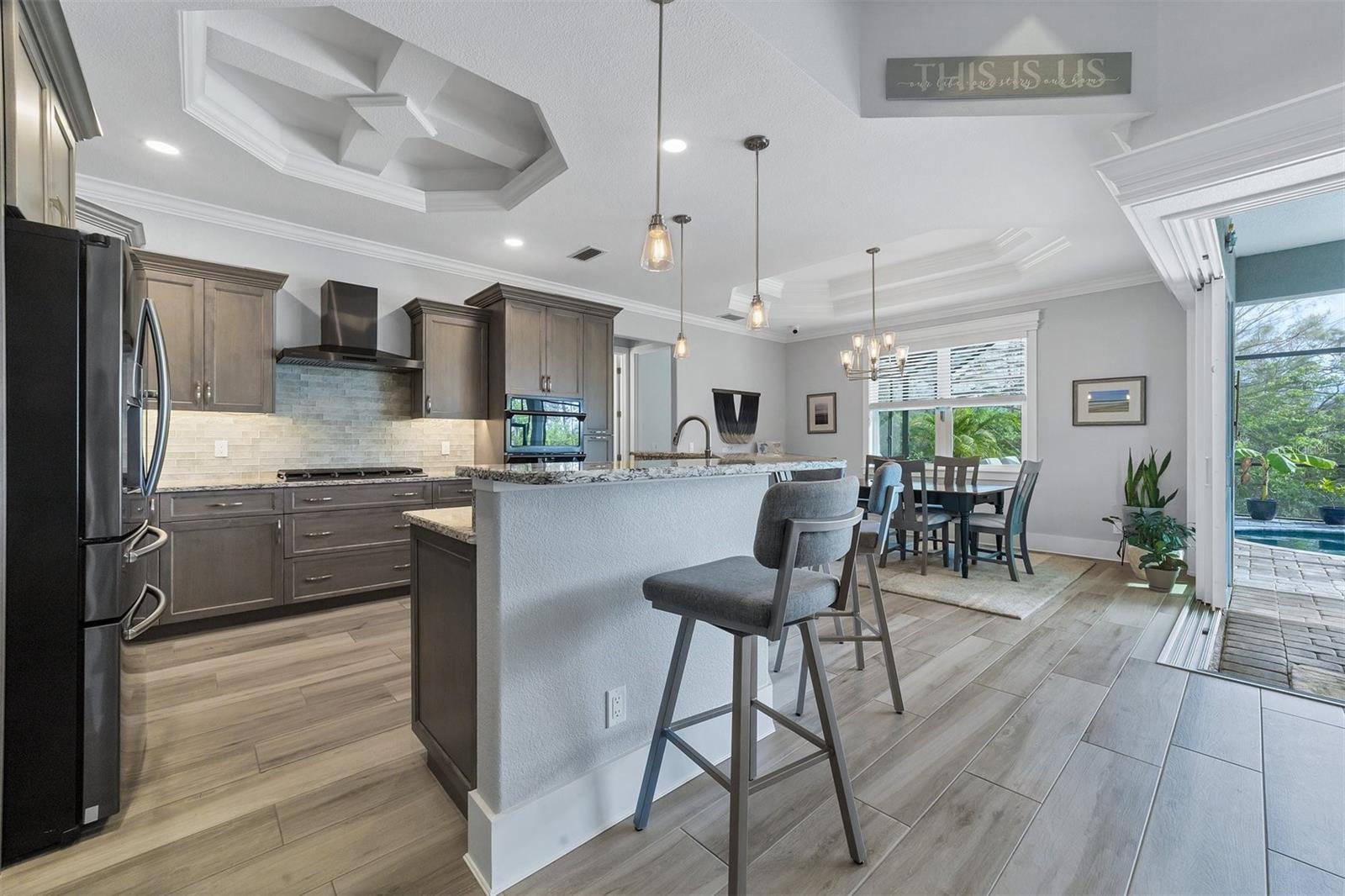 Custom central kitchen with wrap around bar
