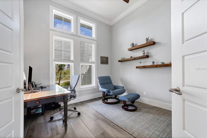 Private Den tucked behind double doors overlooking gardens.