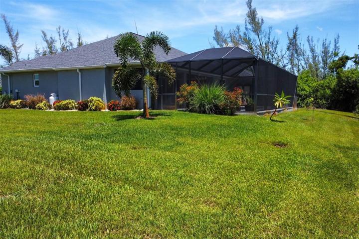 Tropical landscaping provides additional privacy.
