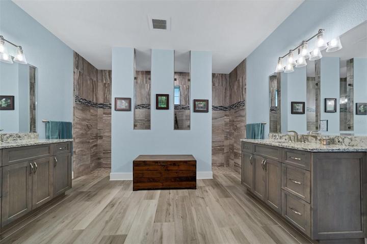 Amazing master ensuite with split vanities and walk-through shower.