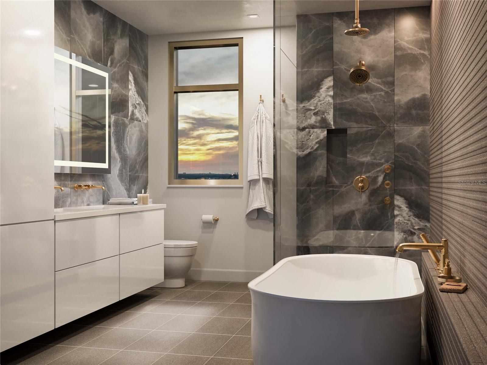 The owners bathroom has 2 sinks, a toto toilet, a soaking tub, Brizzo plumbing and a walk in shower.