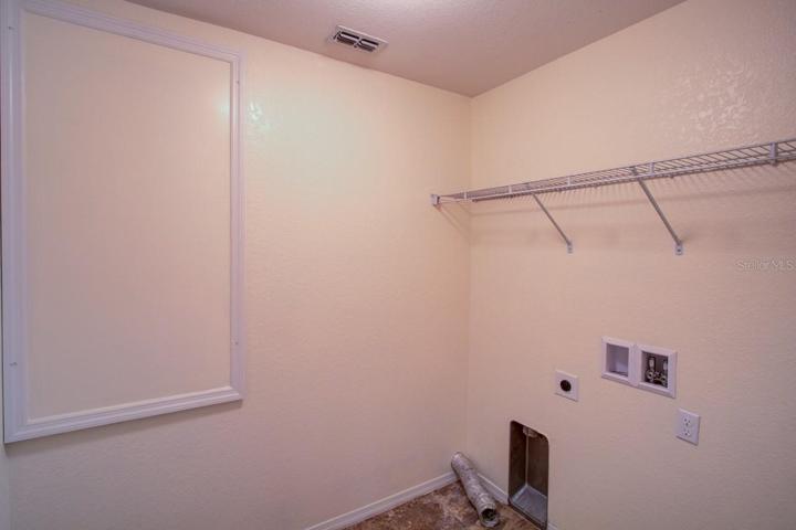 Inside washer and dryer.