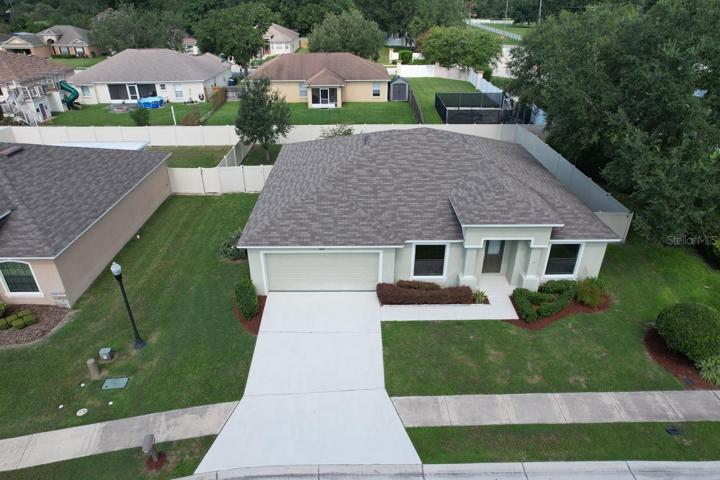Front of the home. Corner lot and completely fenced in.