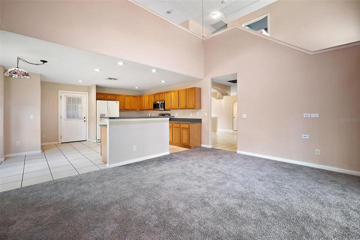 Family Room opens to Kitchen.