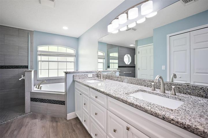 Master Bathroom with Granite Counters and Double Sinks.
