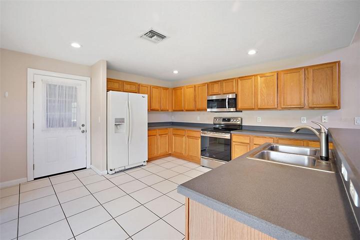 Kitchen has ample cabinets and counter space. *REFRIGERATOR is not included!