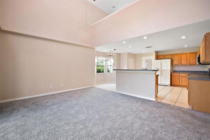 Family Room adjacent to Kitchen with Snack Bar AND Eat-in Dining.