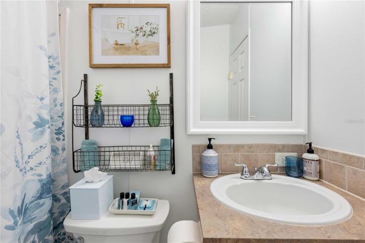 Guest bath has updated Granite sink, tub/shower, high toilet, and fresh paint.