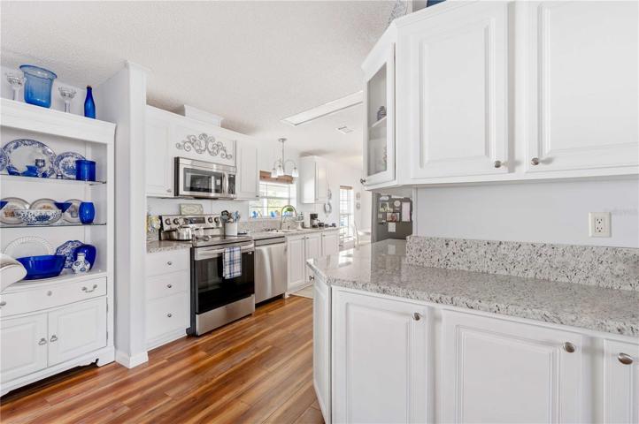 Also, This kitchen has many cabinets with pull out shelves' organizers