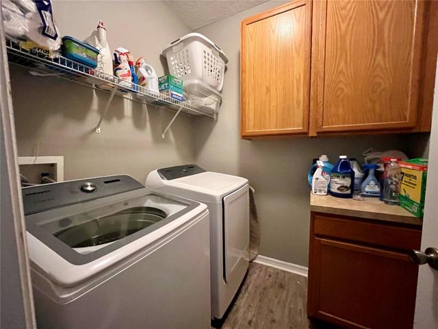 Laundry with cabinets upstairs