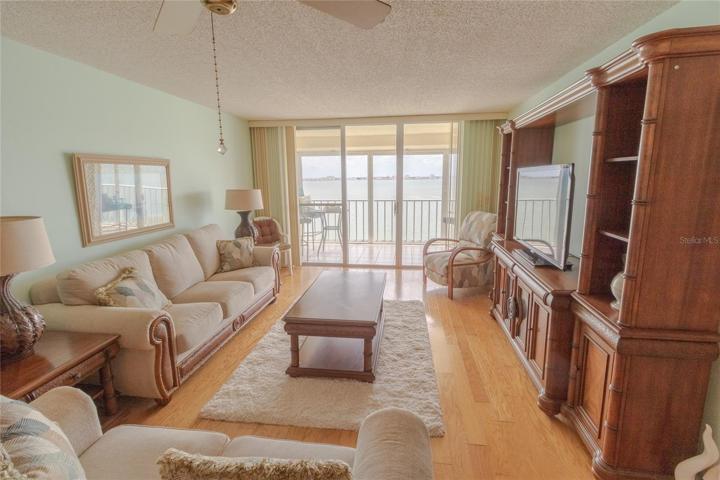 Living Room Area w/ Bay Views &  Balcony Access.