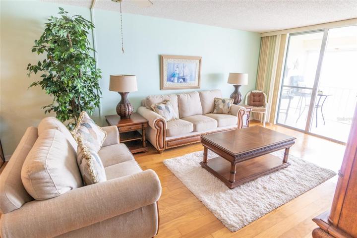 Living Room Area w/ Bay Views &  Balcony Access.