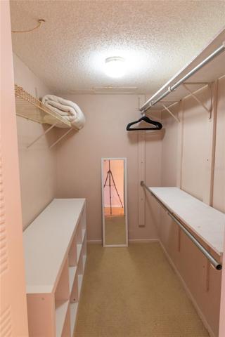 Walk-in Closet In Master Bedroom.