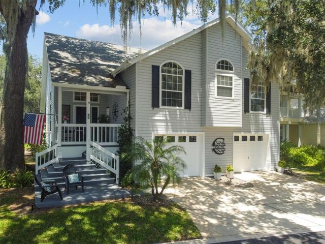 Welcome to 234 River Village Drive in Debary in the Exclusive Waterfront "River Oaks" Gated Community.