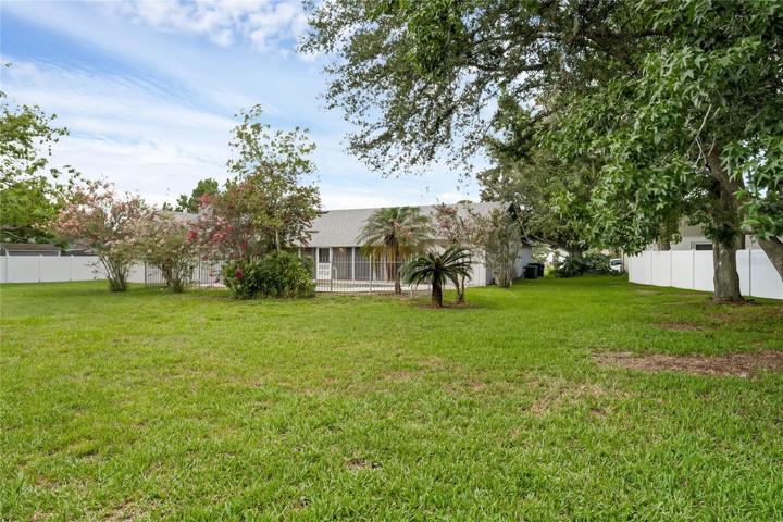 Larger partial fenced lot .42 of acre