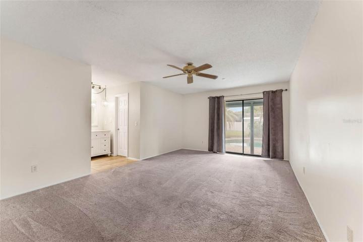 Primary Suite with access to patio/pool area