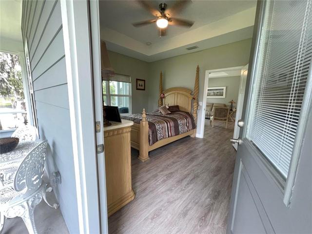 Exterior door to wrap around screened porch in Master Suite