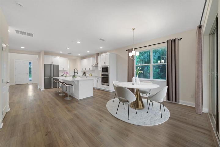From the moment you step inside, you'll be greeted by a spacious flowing layout that provides ample natural light throughout as well as LUXURY VINYL PLANK FLOORS in the main living areas! Furniture, accents and fridge are Virtually Staged.