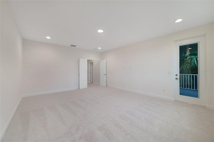 Your primary suite is a true oasis, offering a blank canvas to create a space you love with a luxurious private en-suite bath and walk-in closet!