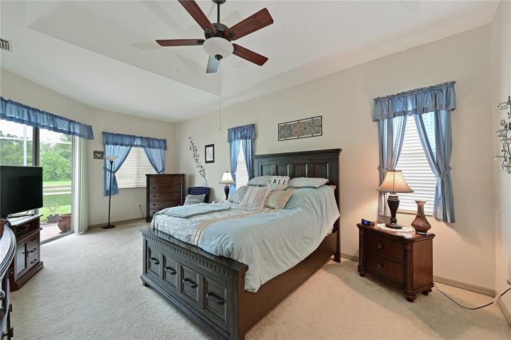 Primary bedroom with slider to lanai