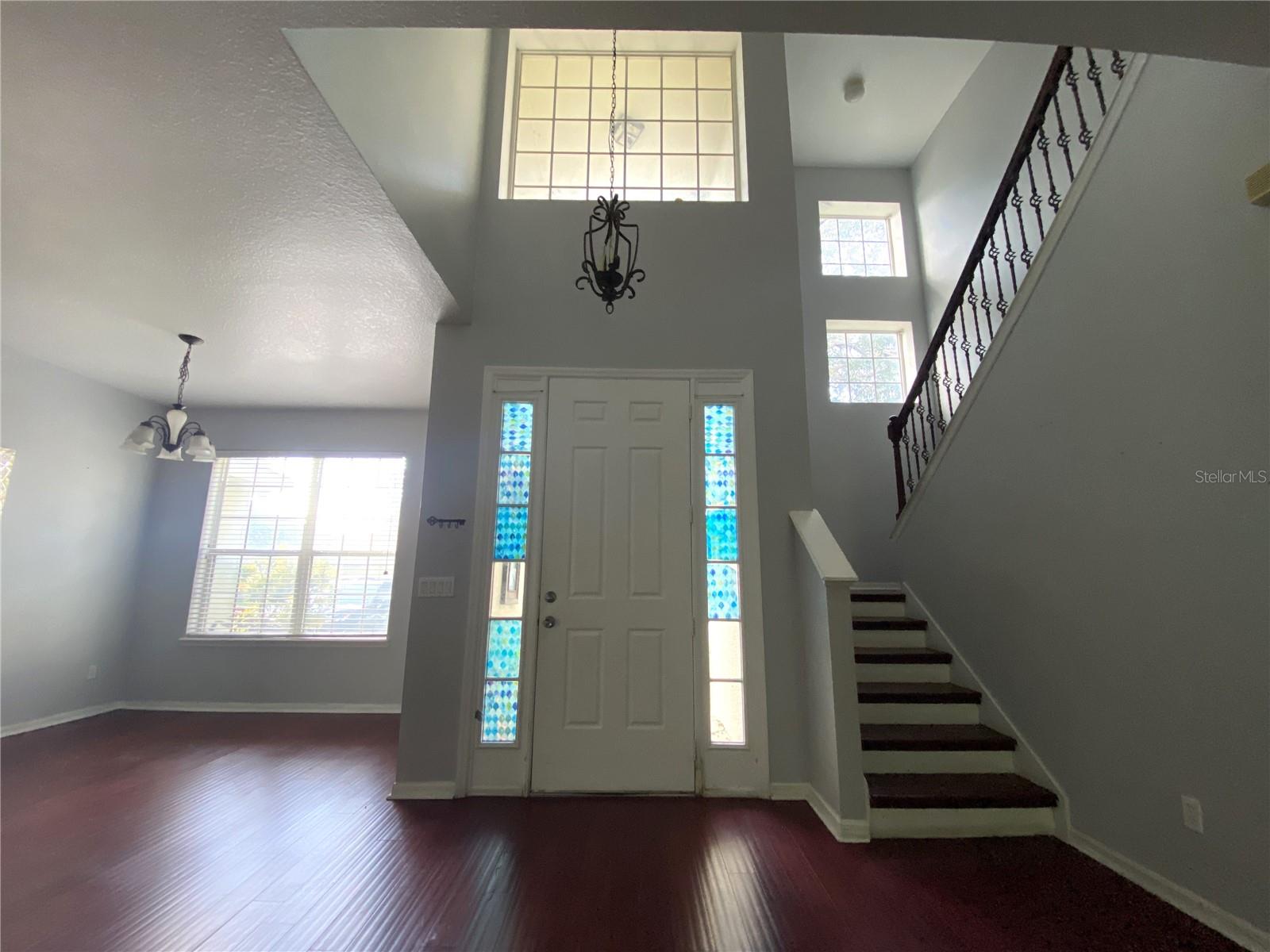Front door, dining on left, stairs to upstairs 4 bedrooms and 2 baths