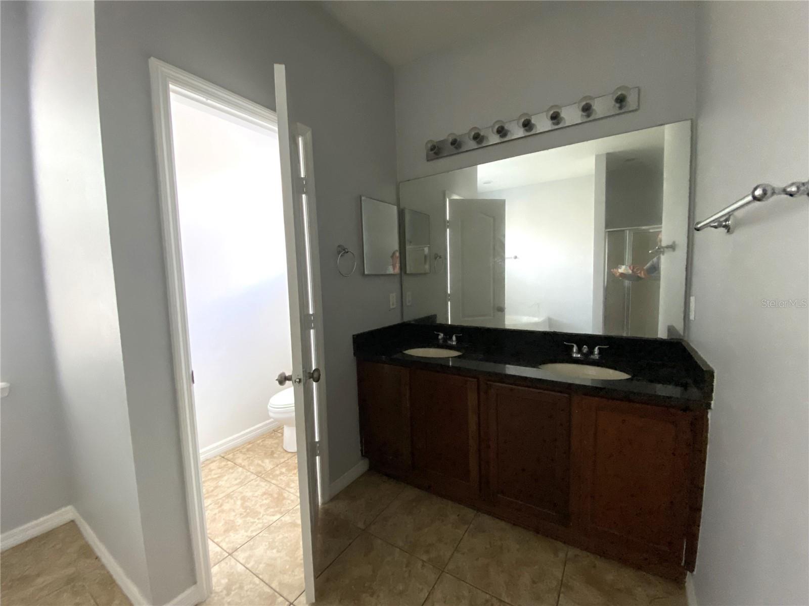 Toilet closet and double vanity in master bath