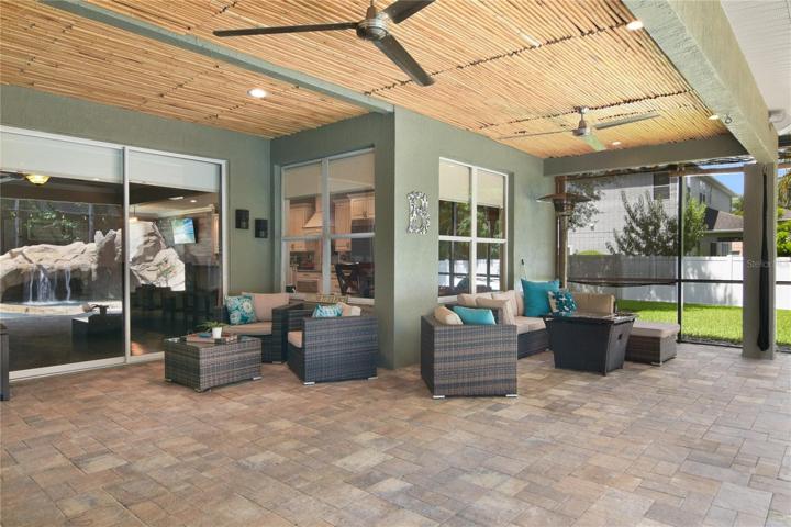 Relax poolside under the covered lanai!