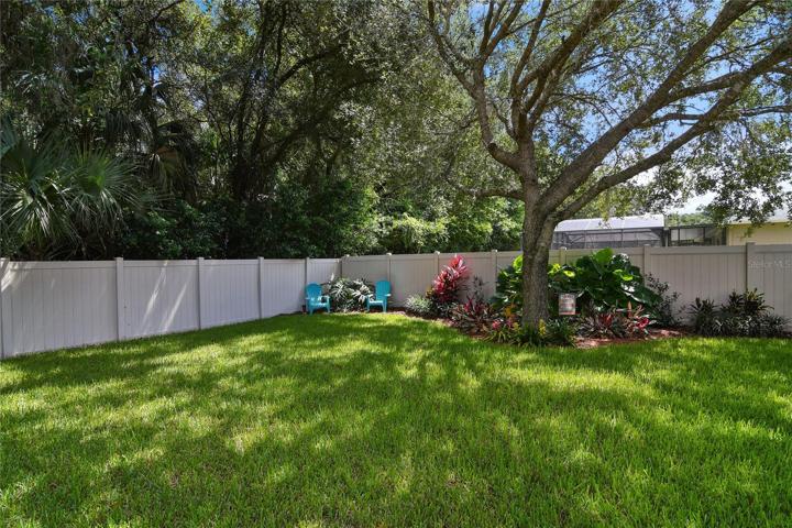 On a large 1/3 ACRE LOT with a 3-CAR GARAGE and a WOODED VIEW!