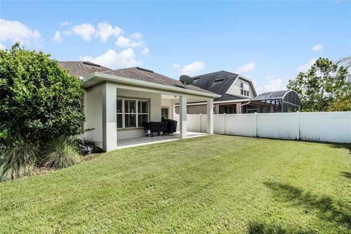 Covered lanai overlooks a spacious fenced yard!