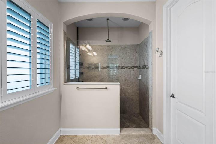 Oversized custom tiled walk-in shower with dual (rain!) shower heads!