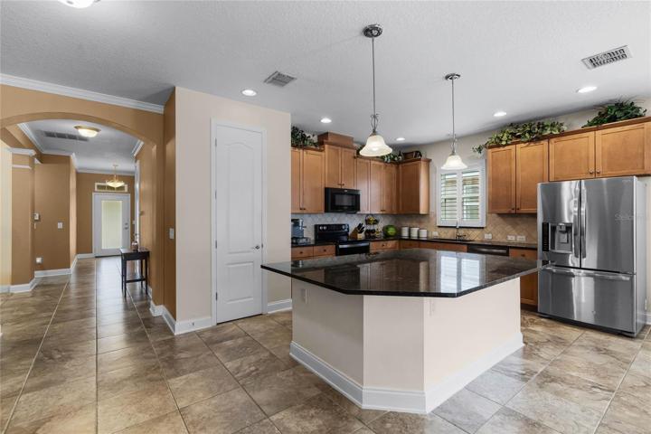 The family chef will fall in love with the bright open kitchen delivering plenty of storage between the 42” cabinets and pantry, STONE COUNTERS, decorative backsplash, updated appliances and a huge ISLAND under pendant lighting with breakfast bar seating!