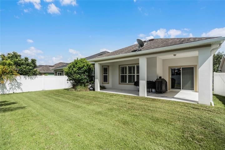 Covered lanai overlooks a spacious fenced yard!