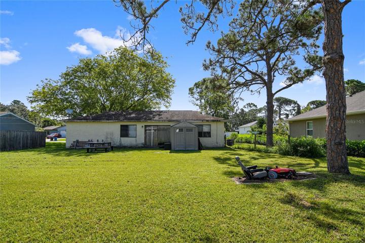 The almost quarter acre lot has lovely mature trees and bordering neighbors create a partial fence!