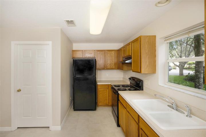Side kitchen view with door to bathroom