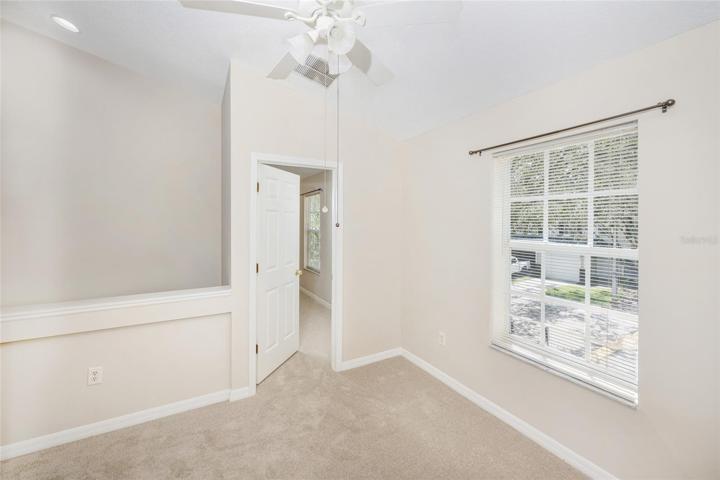 Loft area looking into second bedroom