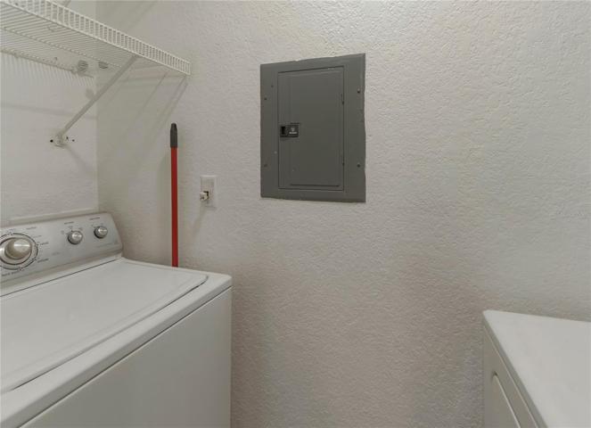 In unit laundry room w/ storage